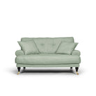 Blanca Love Seat Pistage är en liten Howard-soffa i grön linne från Melimeli